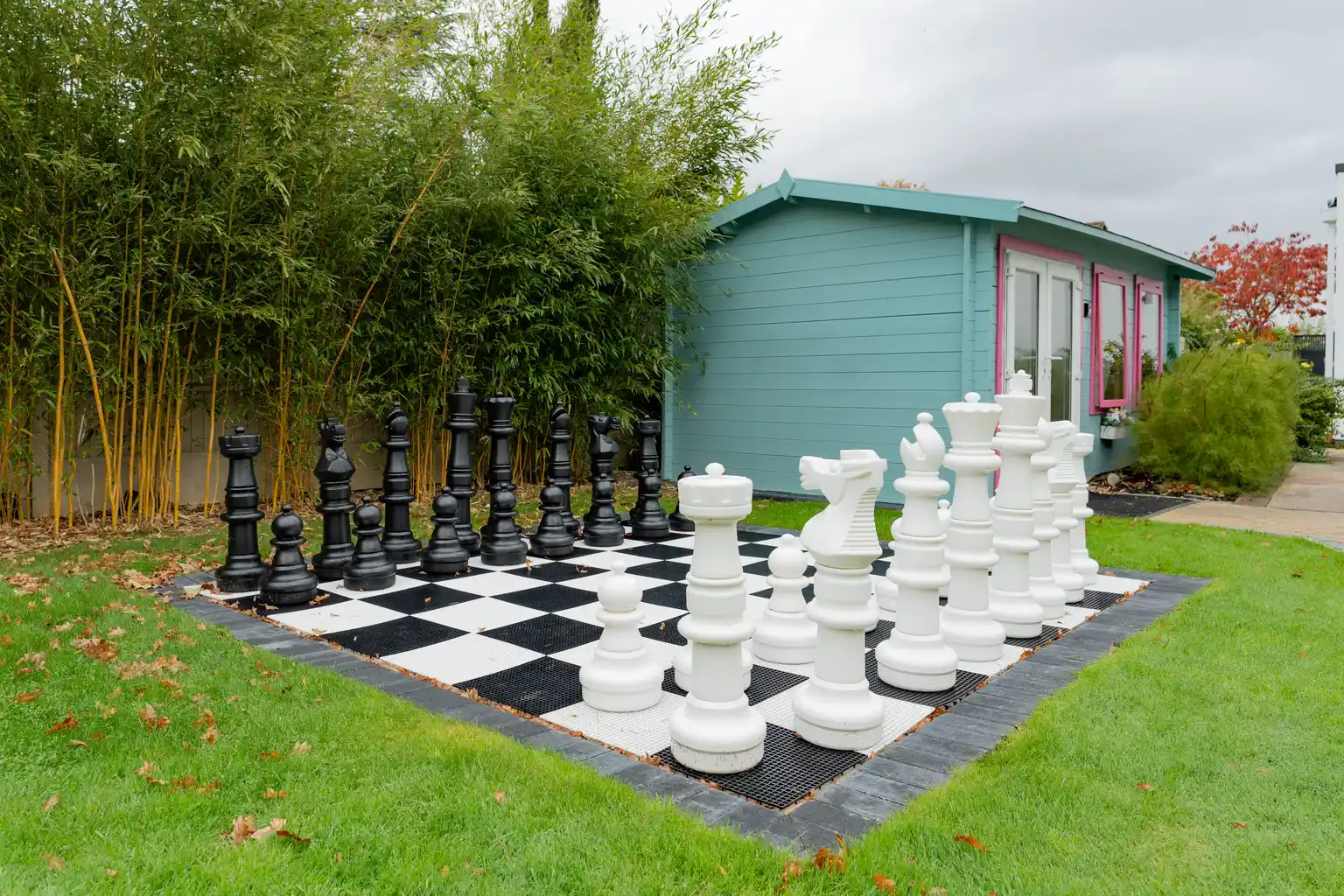 Giant garden chess set in the grounds of an English Oak care home